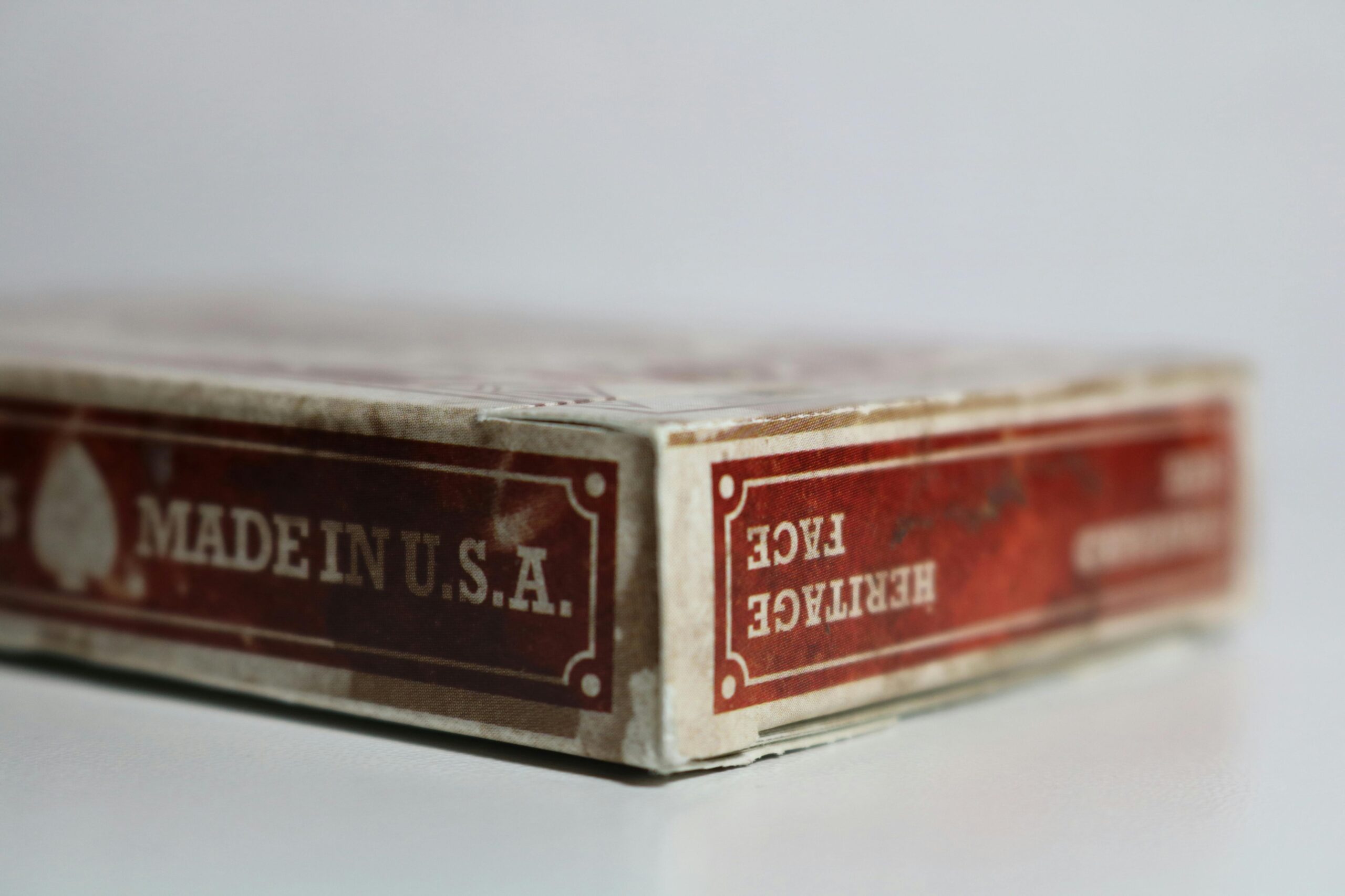 Vintage playing card box with 'Made in USA' text in a close-up shot.